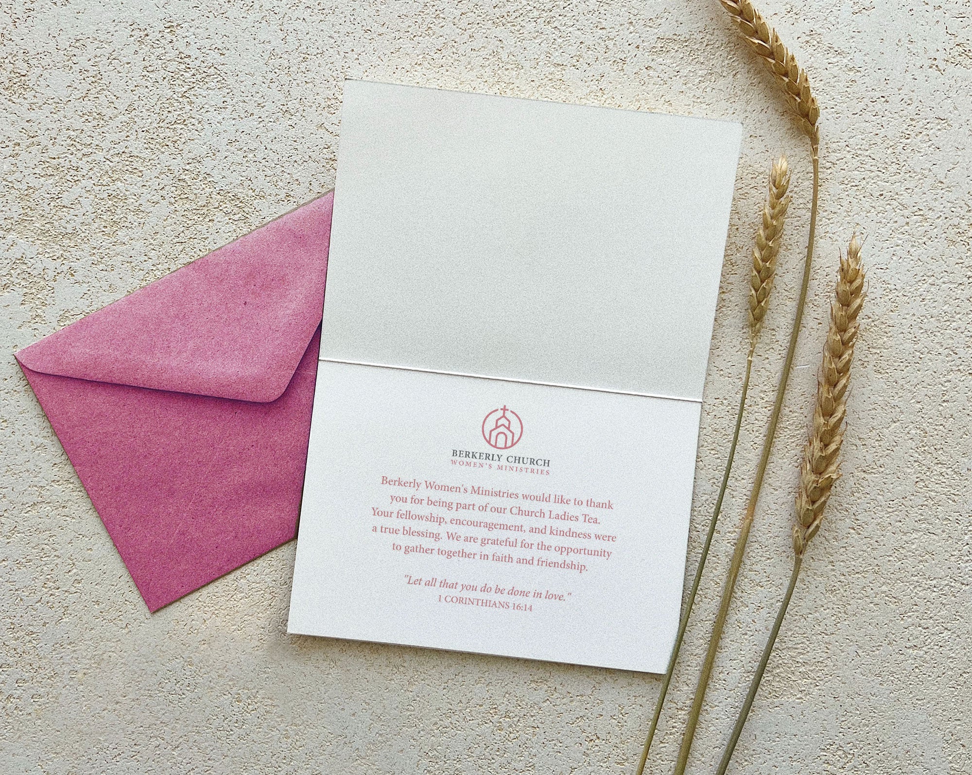 religious thank you tent card open showing the inside text next to a pink envelope