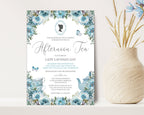 pretty blue flower Invitation card for an afternoon tea event with bridgerton-inspired cameo on a white surface next to a vase of dried flowers.