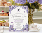 A floral afternoon tea invitation card displayed on a table with a teacup, pastries, and purple roses in the background.