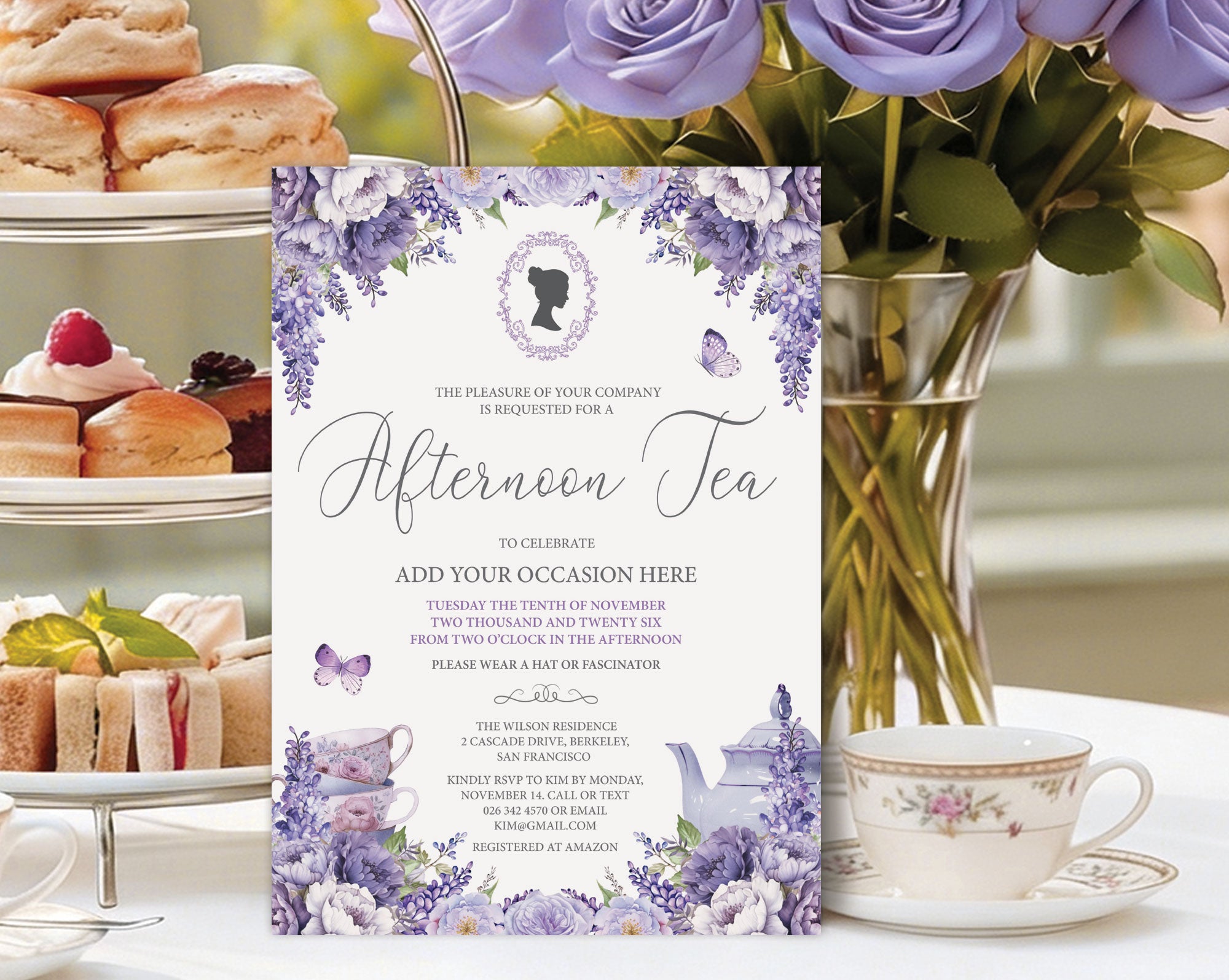 A floral afternoon tea invitation card displayed on a table with a teacup, pastries, and purple roses in the background.