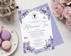 A lavender and purple floral 'Afternoon Tea' invitation card styled in a flat lay with pink roses, a silver teapot, and pastel macarons on a white surface.