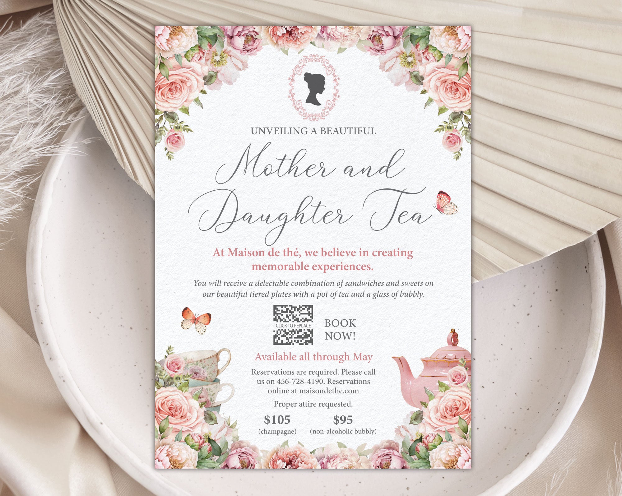 pretty blush pink mother and daughter regency style afternoon tea event invitation with cameo and teapot graphics laying on a white plate with a dried leaf in the background