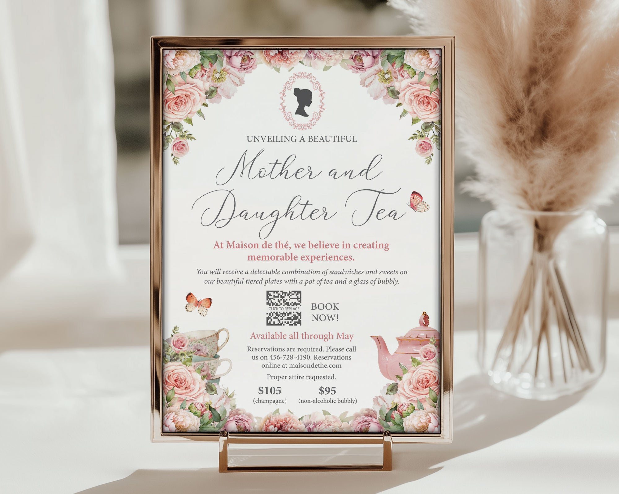 mother and daughter tea invitation with QR code and cameo, in a frame on a small stand on a white table in front of a vase with dried flowers