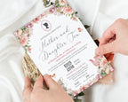 two hands holding a mother and daughter tea business event invitation with cameo and teapot graphics over a white background