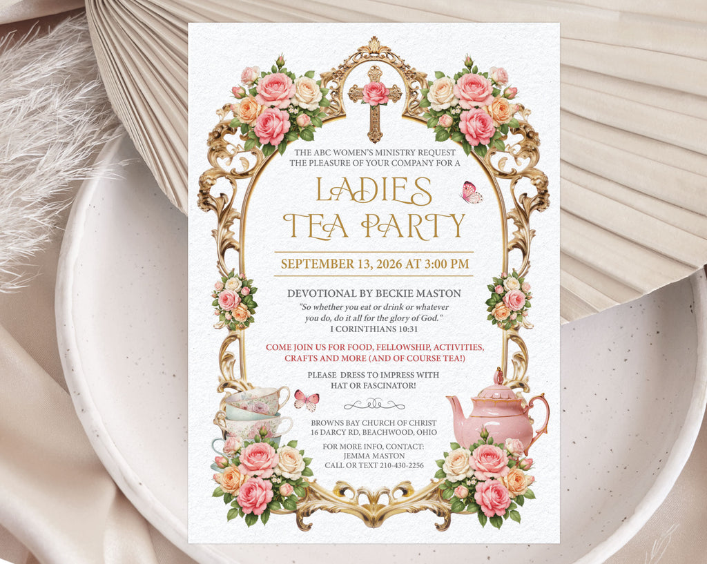 Pretty church ladies tea party invitation with gold frame, christian cross and teapot graphics laying on a white plate with a dried leaf in the background