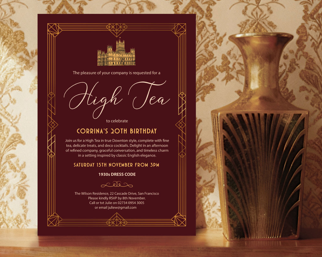 burgundy and gold art deco styled downton high tea birthday invitation leaning up against a gold patterned wall next to a gold art deco vase