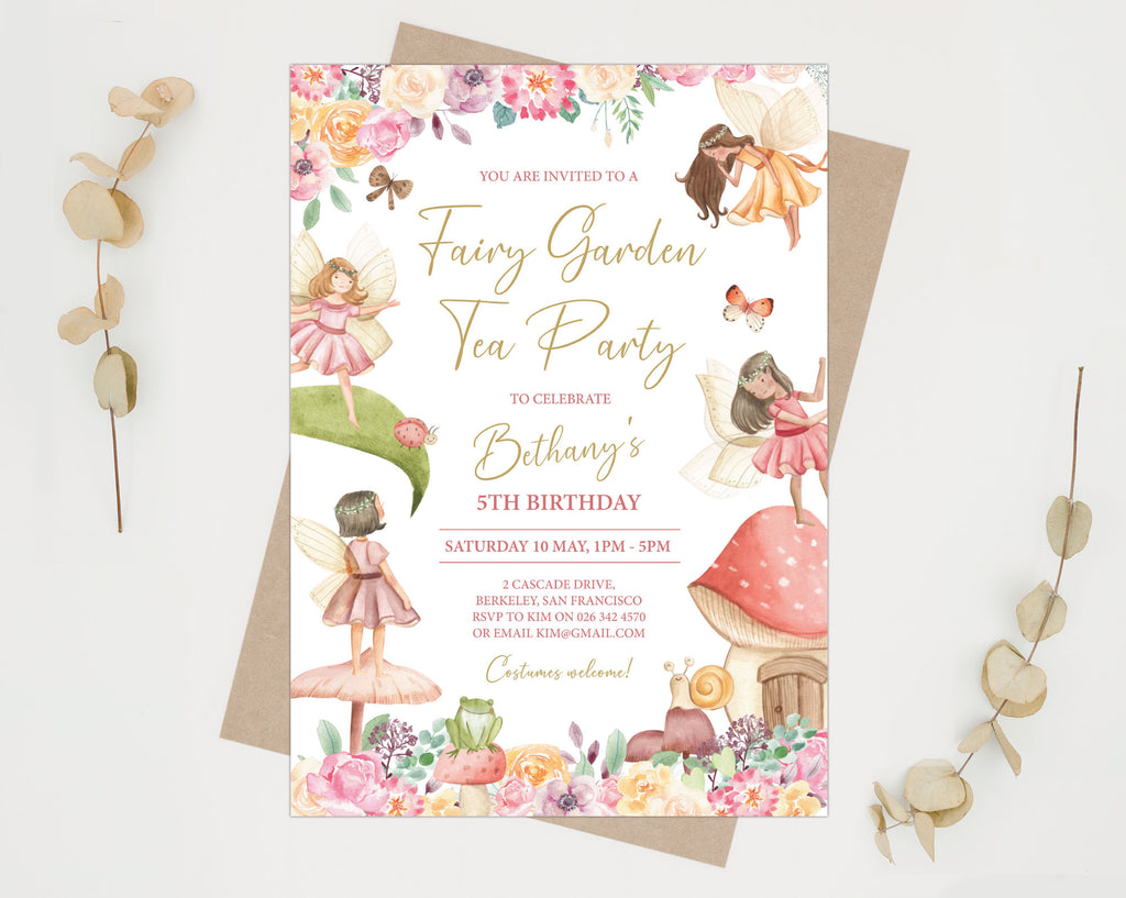 kid's birthday fairy garden tea invitation laying on a brown envelope on a grey background