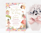 a fairy garden birthday invitation leaning up against a white wall next to a white plant and pot wrapped with pretty pink ribbon