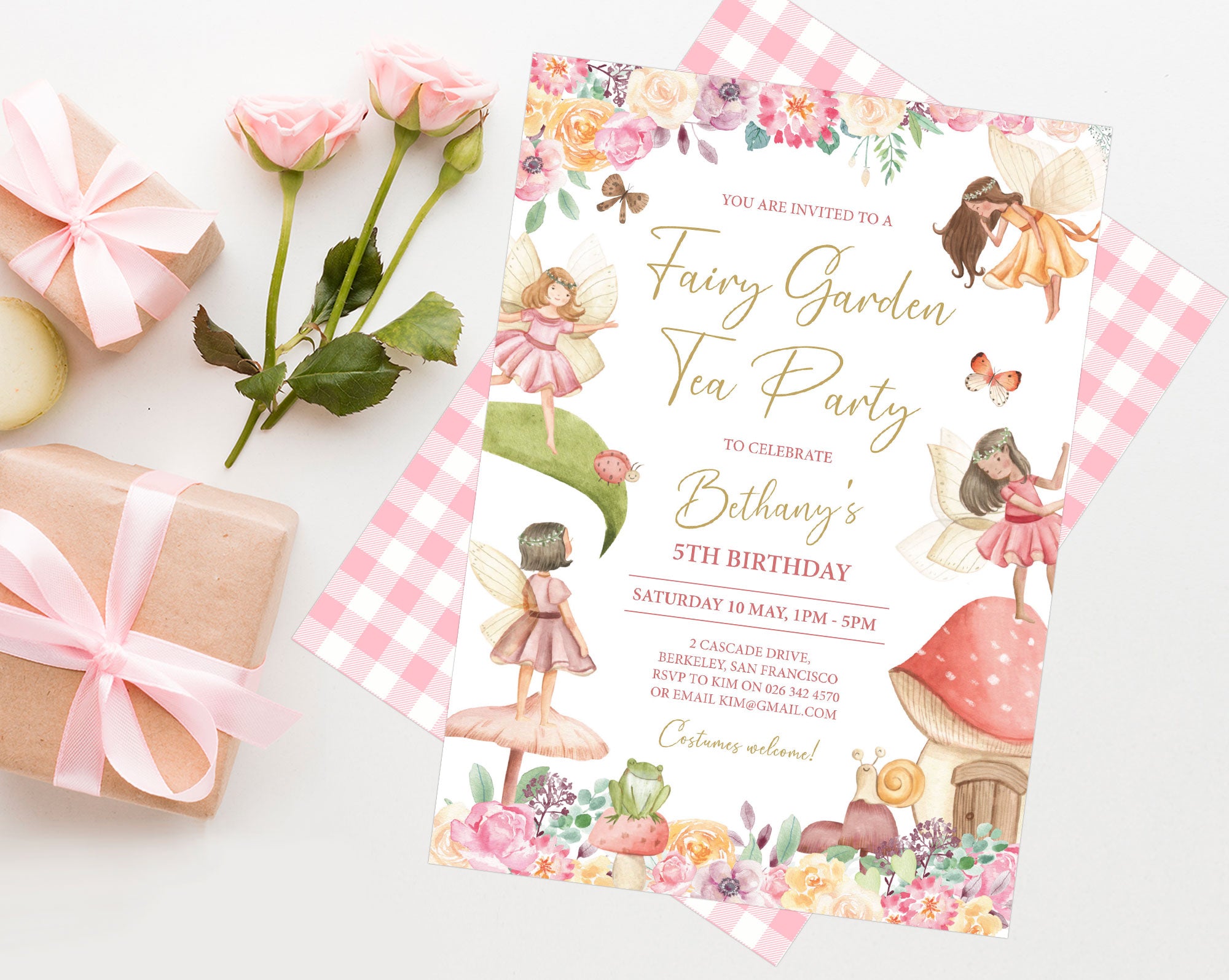 Pretty fairy tea party invitation with gingham back laying on a white background next to two wrapped gifts and some roses