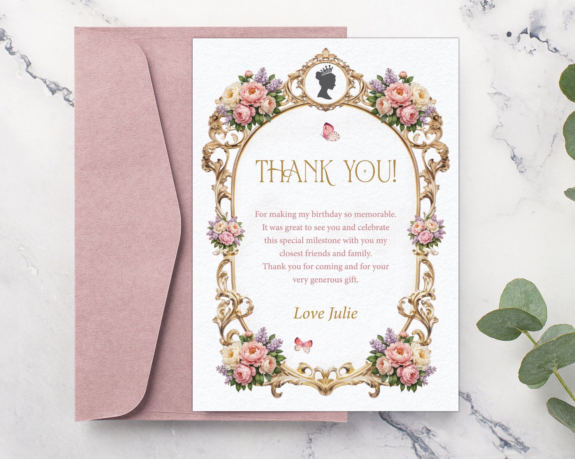 Pretty thank you note with pastel peonies, gold freame, cameo graphics laying on a blush pink envelope on a marble surface