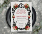 A black and red gothic high tea invitation with a cameo, teapot dragonfly and butterfly graphics laying on a black plate on a grey background