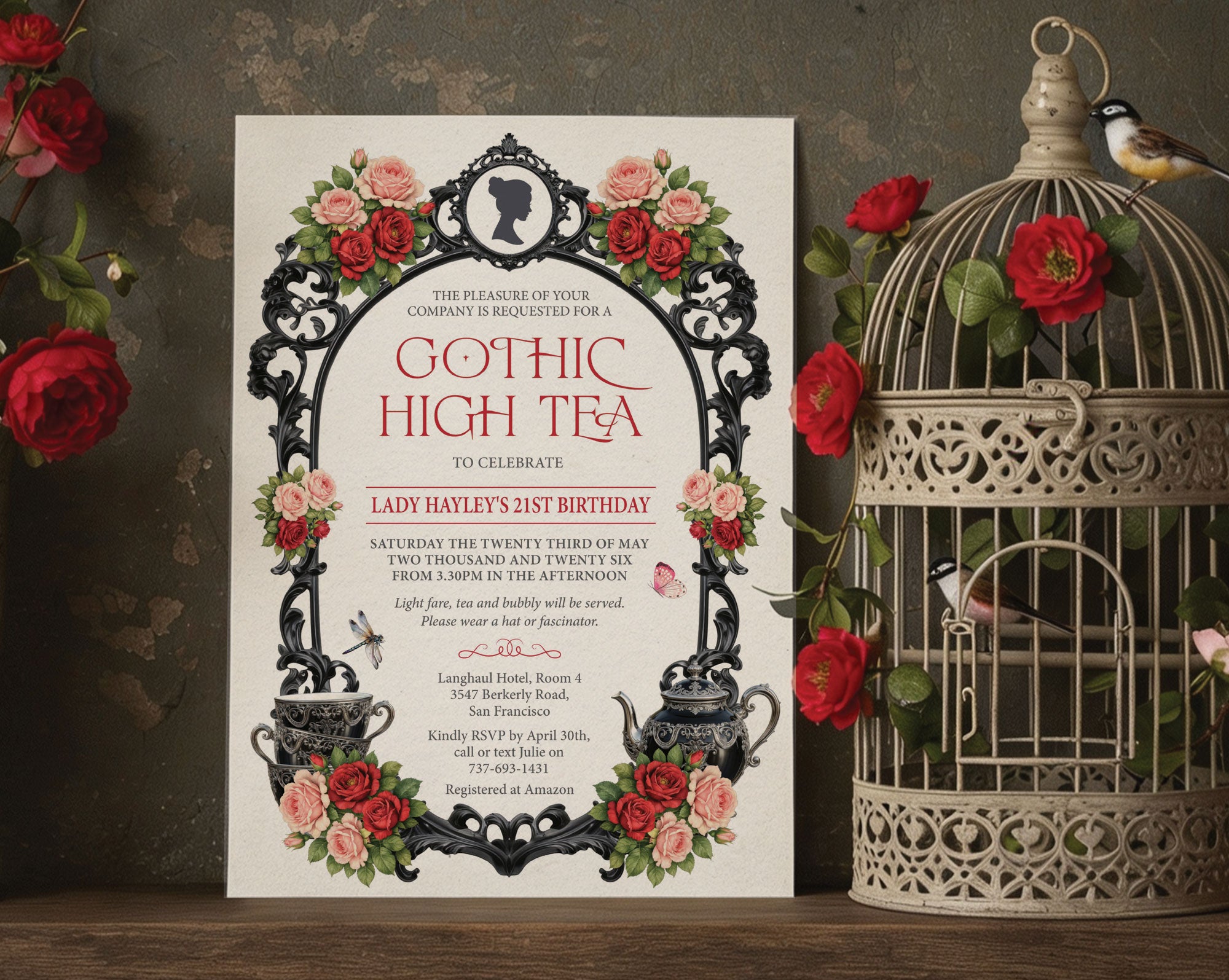 Pretty bird cage with birds and red flowers with a 5 x 7 regency gothic high tea invitation leaning against it