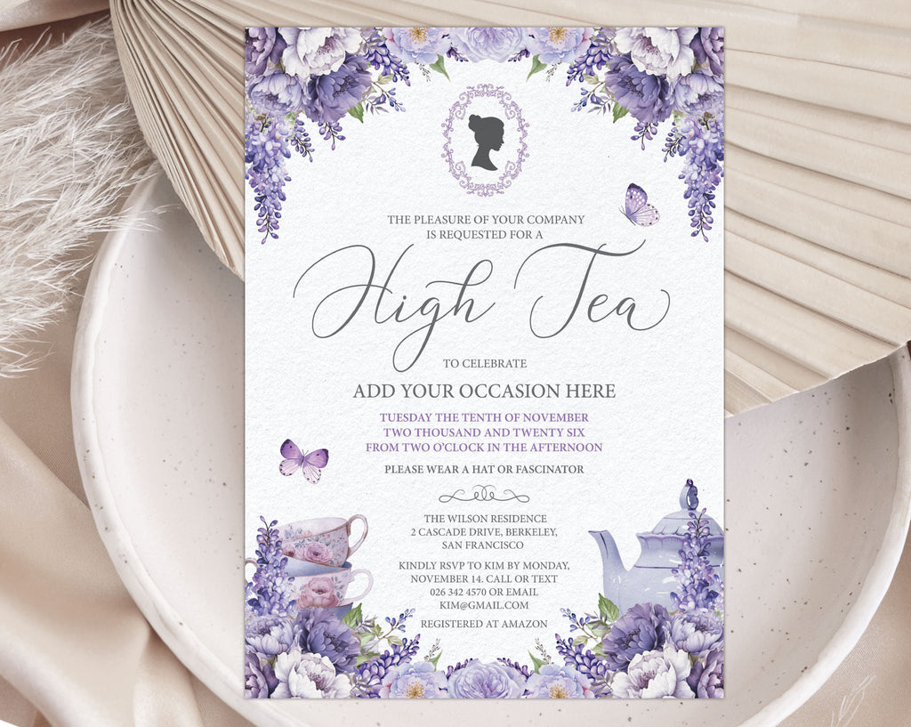 pretty lavender colored flower high tea invitation laying on a white plate with a dried leaf in the background