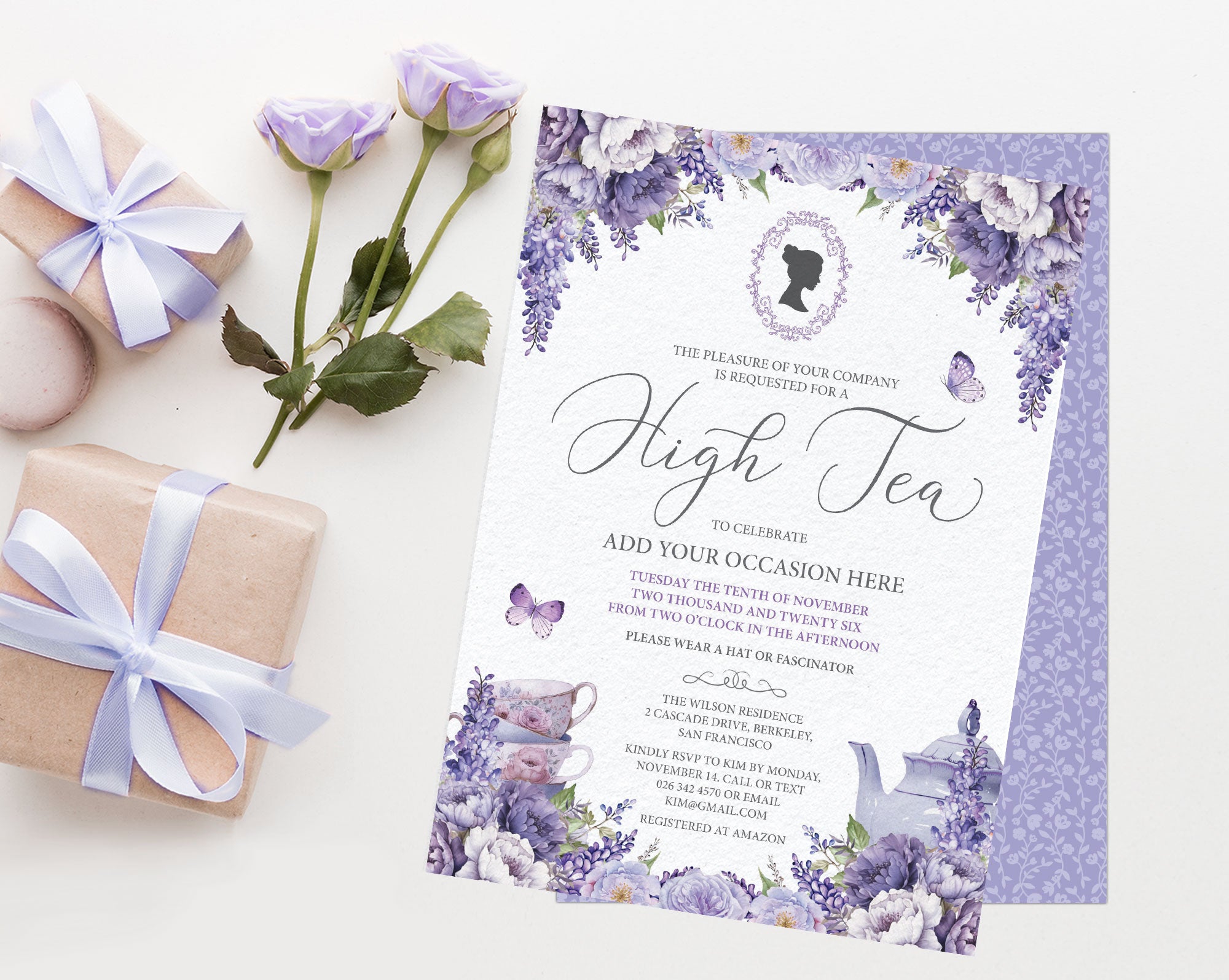 elegant high tea invitation with purple flowers and regency cameo, laying on a white background next to soft lilac roses and wrapped gifts