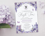 elegant purple flower regency style high tea party invitation laying on a grey background next to some light purple hydrangeas
