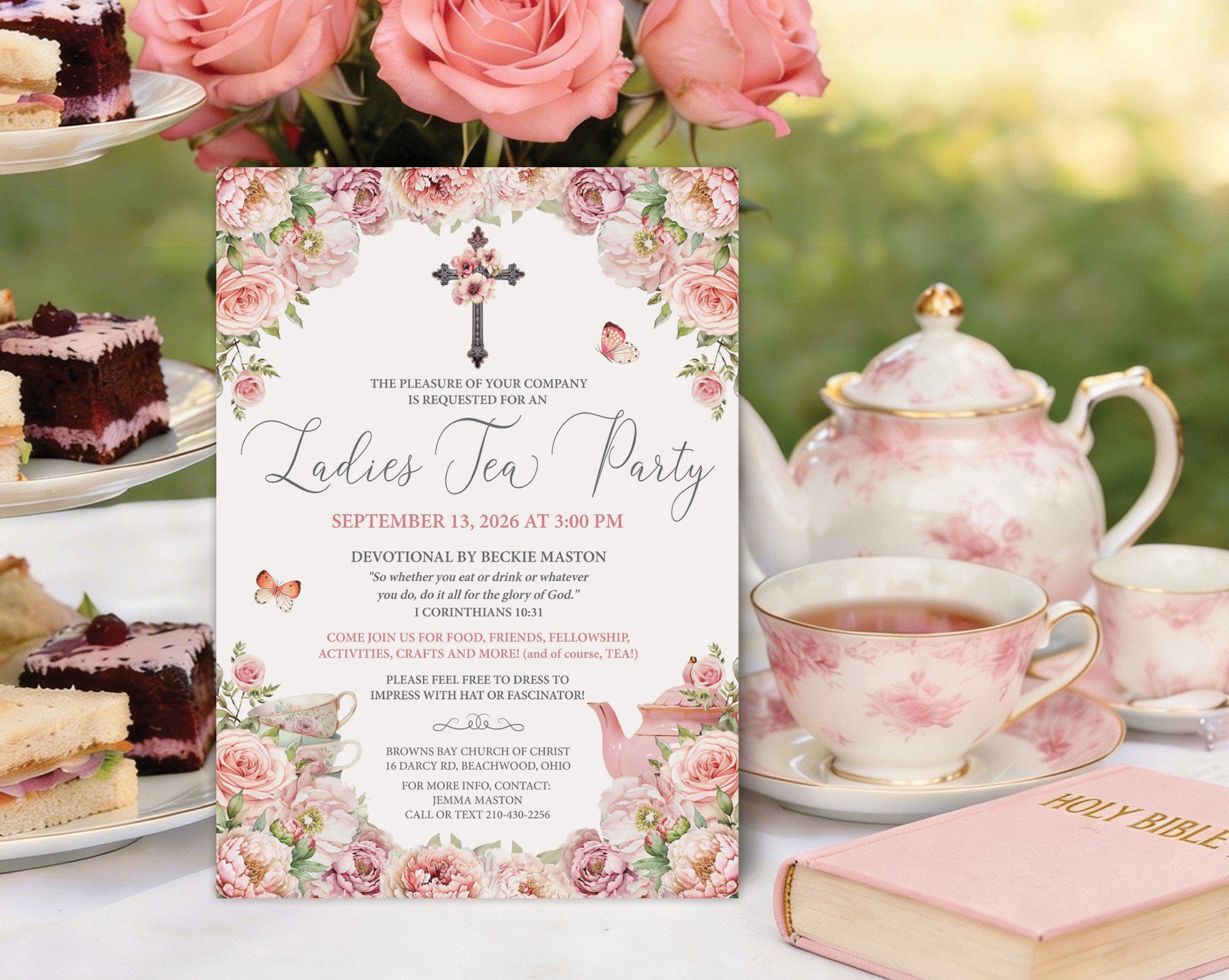 a blush pink women's ministries church tea invitation on an elegant tea table, leaning against a tiered stand with food, next to a teapot, cups and pink holy bible