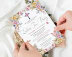 two hands holding a 5 x 7 church ladies tea party invitation in pastel design, over a white background