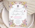 pastel flower Invitation card for 'Mother and Daughter Tea' event with floral design on a textured surface.