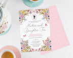 Invitation card for 'Mother and Daughter Tea' surrounded by a pink and green tea service on a white surface.