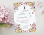 pretty pink hydrangeas next to a mother and daughter tea invitation with a pastel flower and cameo design lying on a white cloth