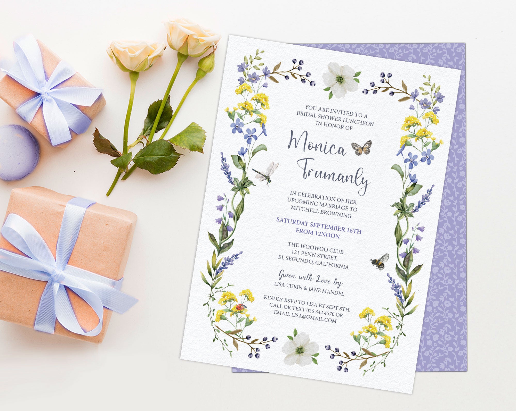 pretty purple and yellow wildflower bridal lunch invitation laying on a white background next to some yellow roses and 2 wrapped gifts