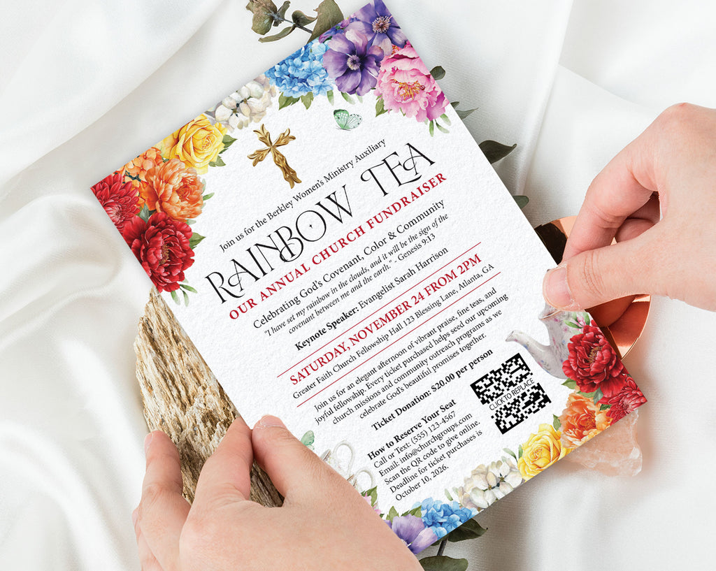 two hands holding a rainbow tea church rainbow money raising event invitation with bright flowers, gold cross and teapot, with a white silk cloth in the background