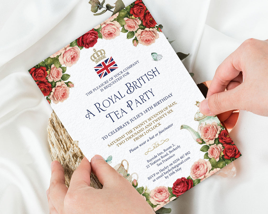 Invitation card for a Royal British Tea Party held by hands on a white fabric background