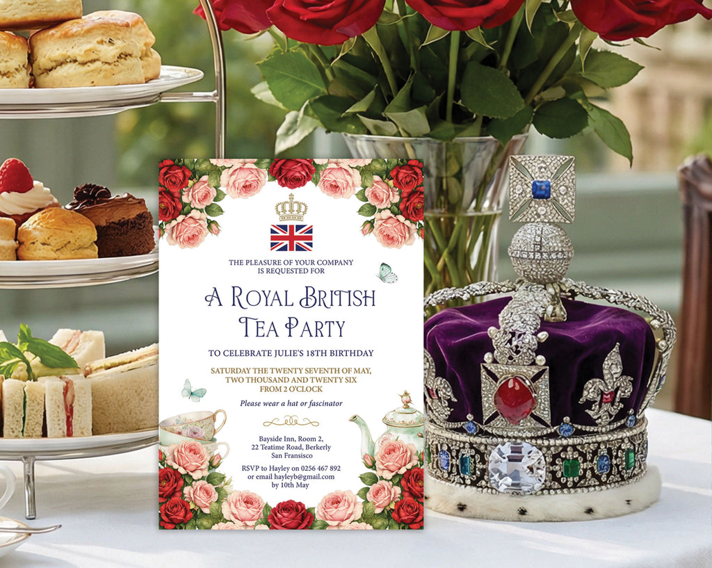Royal British Tea Party invitation leaning up again a tier of sandwiches and cakes next to a royal crown with a jar of red roses in the background