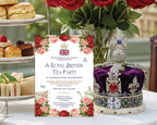 Royal British Tea Party invitation leaning up again a tier of sandwiches and cakes next to a royal crown with a jar of red roses in the background