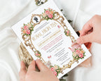 an elegant royal high tea invitation being held by two hands above a white background