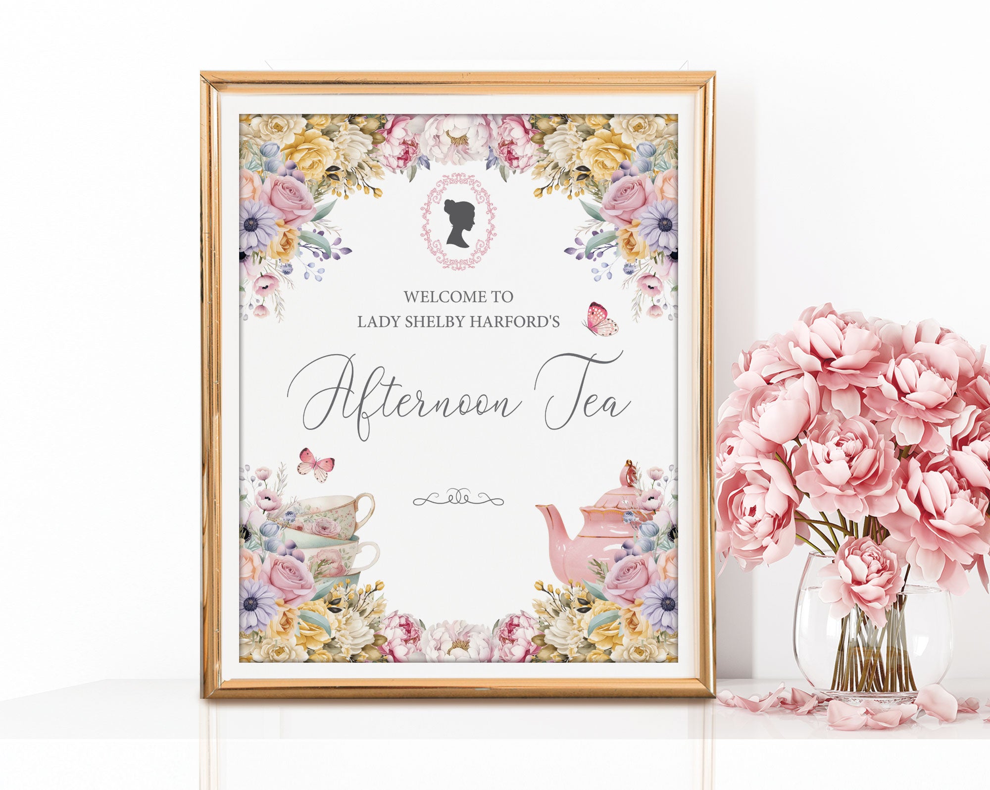 8x10 Regency afternoon Tea Welcome Sign in a gold frame leaning up against a white wall next to some pink flowers in a vase