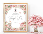 Decorative poster for a high tea event with floral design and a framed silhouette, next to a vase of pink flowers.