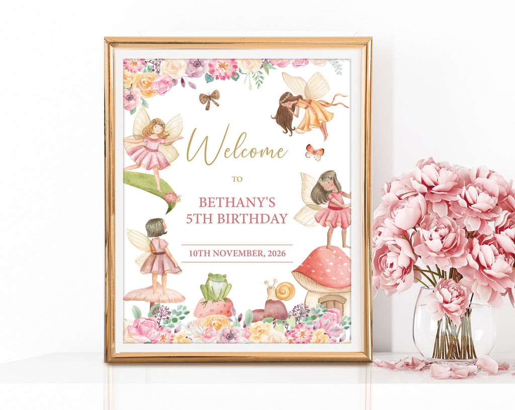 an 8 x 10 fairy tea party welcome sign in a gold frame leaning up against a white wall next to a vase of pink flowers