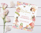 a pretty 8 x 10 fairy garden tea party welcome sign laying on a grey wooden surface next to some lilly's and decorative hearts