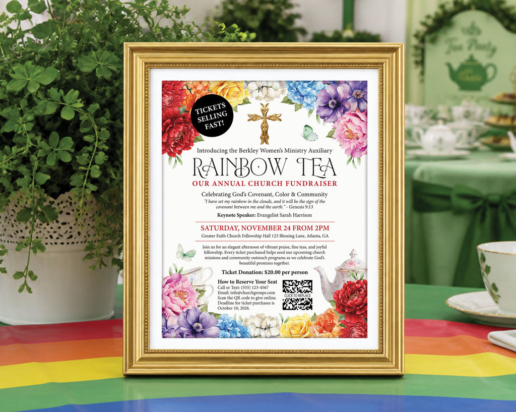 a church ladies rainbow tea fundraising flyer in a gold frame, propped up on a table with a rainbow tablecloth with a white vase with greenery in the background