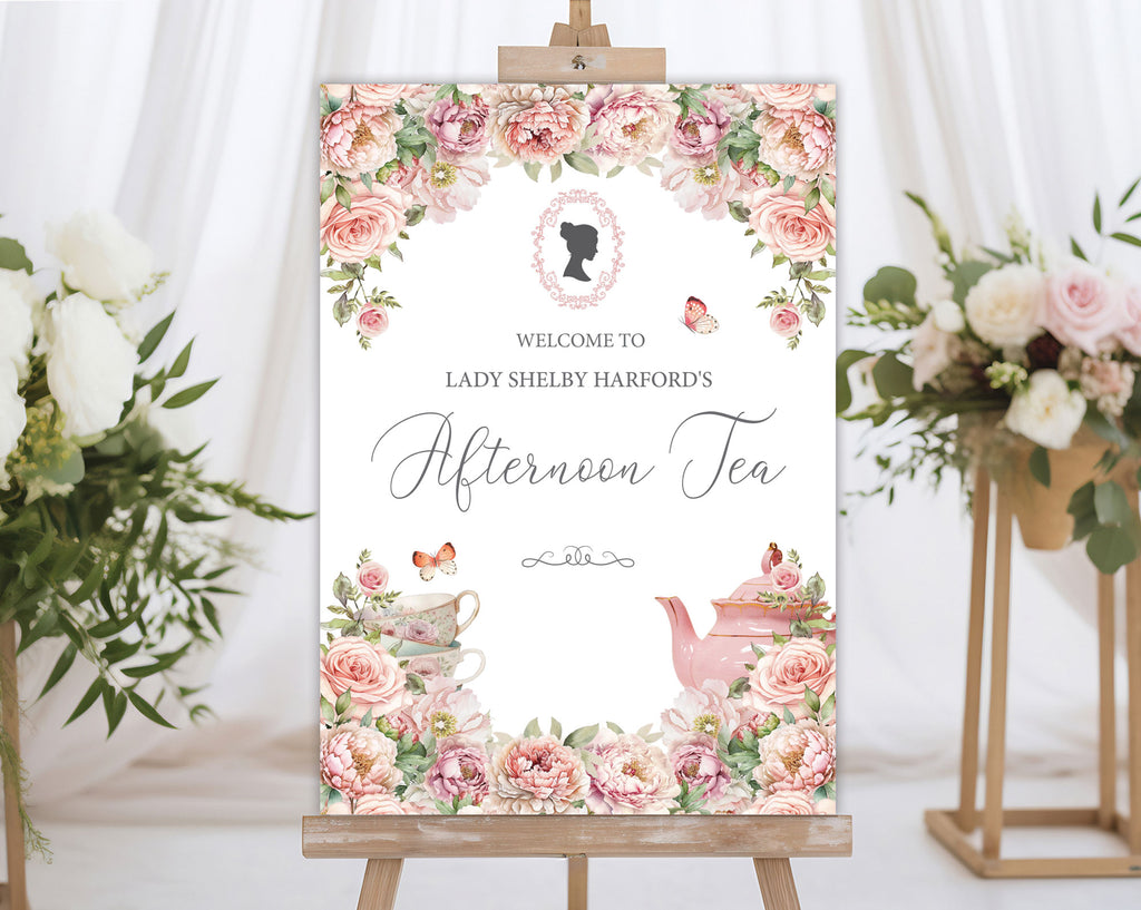elegant pink flower sign for an afternoon tea event with cameo design and teapot illustration, placed on an easel next to flowers.
