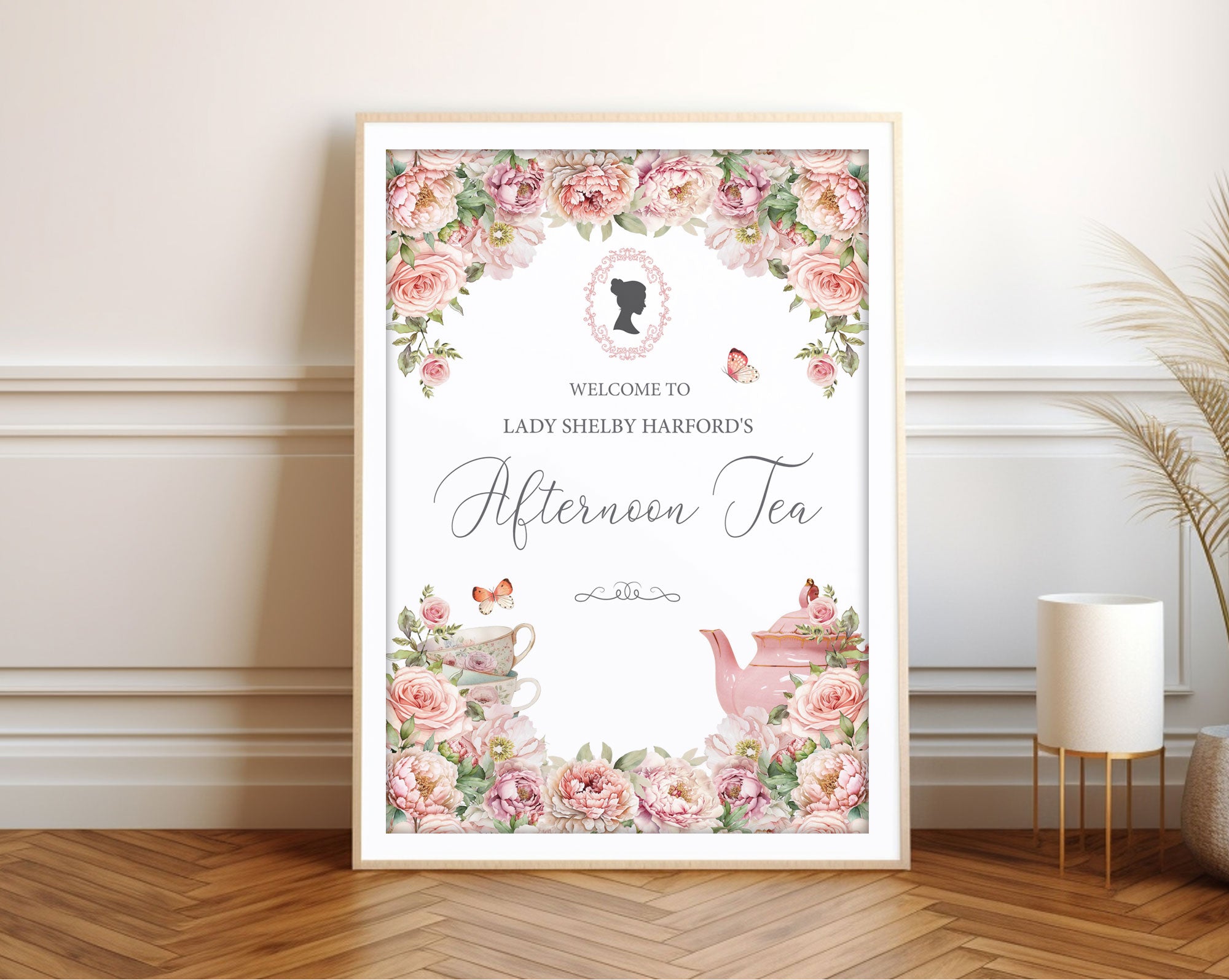 White Framed floral welcome sign with 'Afternoon Tea' text in a room setting
