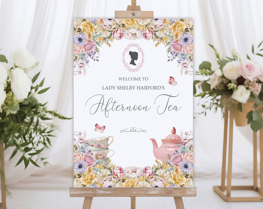 elegant welcome sign for an afternoon tea event with floral design, regency cameo and teacup illustration on an easel next to flowers