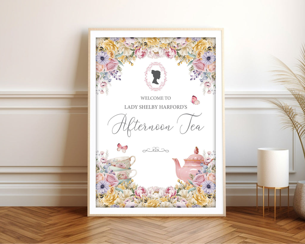 A1 pastel welcome sign  for an afternoon tea event with cameo, butterflies and teapot, framed  and leaning against a white wall