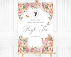 Elegant pink sign for a high tea event with floral design, cameo, butterflies and text on an easel
