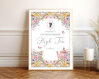 Framed welcome sign with pastel flowers, pink cameo, butterflies and teapot leaning up against a wall