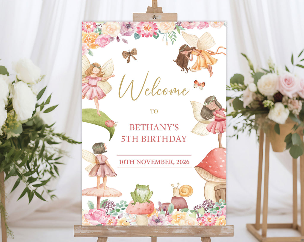 an A1 fairy garden birthday party welcome sign on an easel with flowers on stands in the background