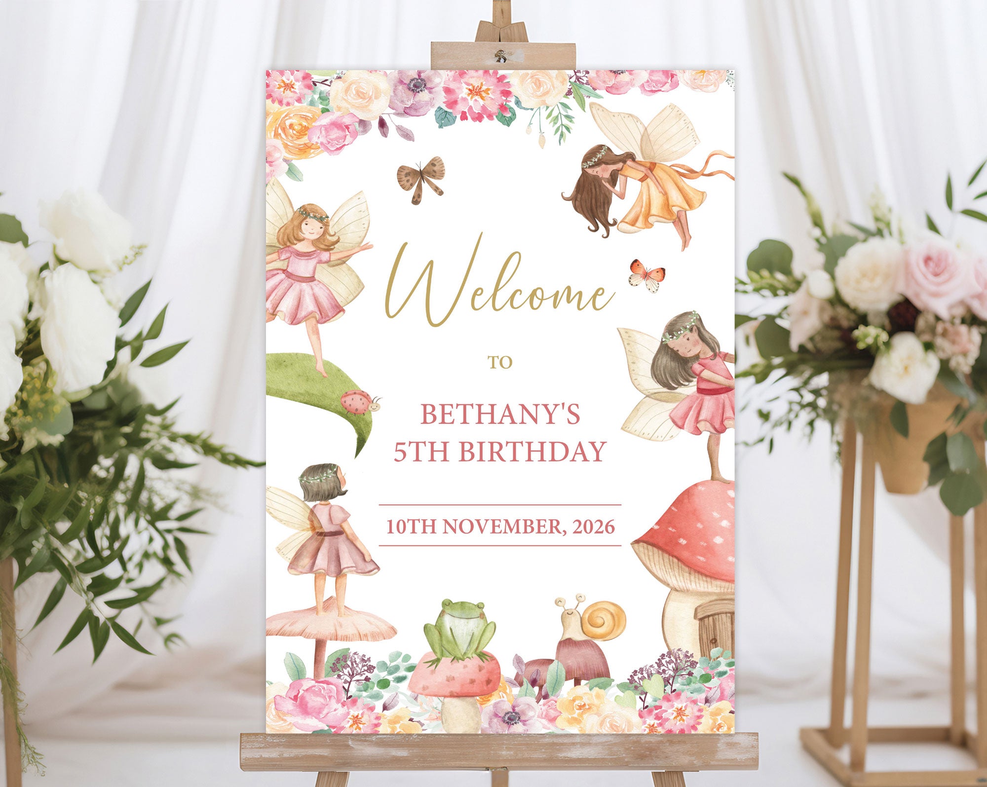 an A1 fairy garden birthday party welcome sign on an easel with flowers on stands in the background