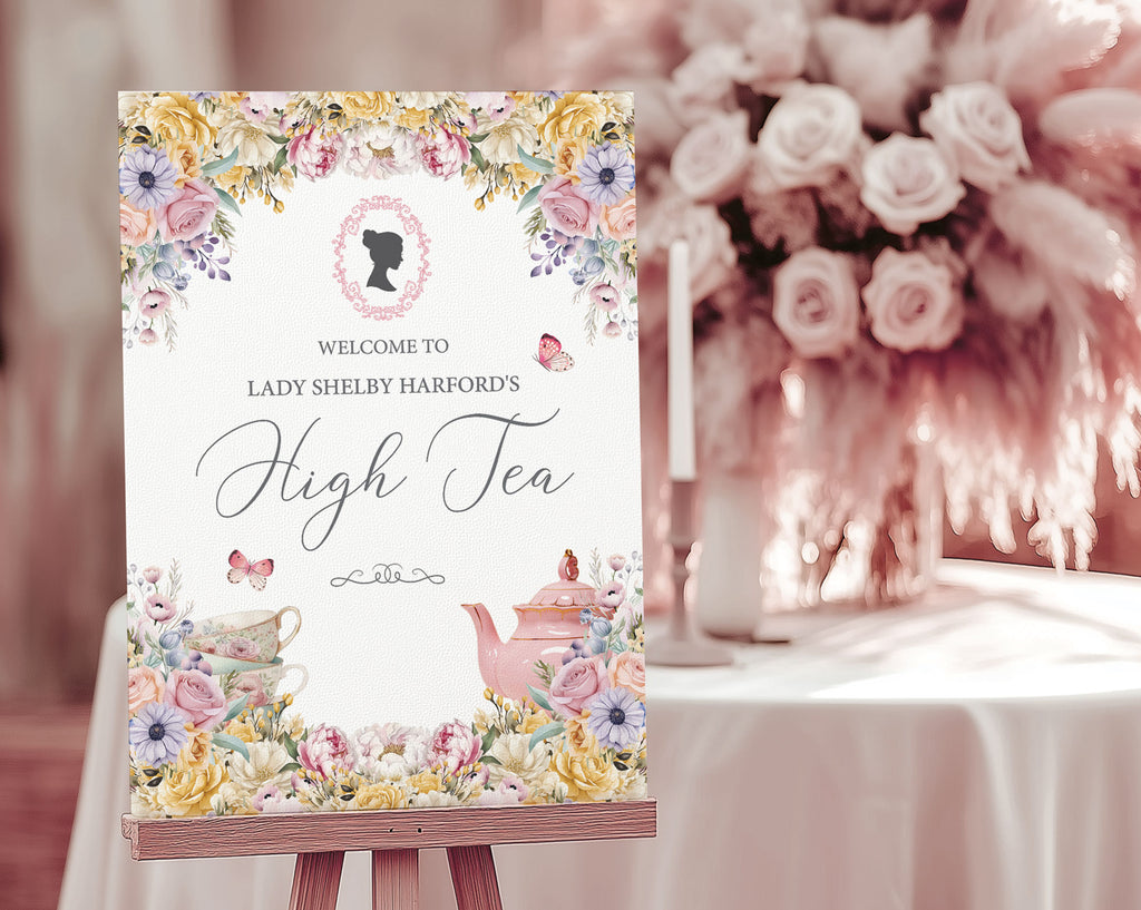Pretty sign for a high tea event with pastel flowers, victorian cameo next to a table setup in the background.