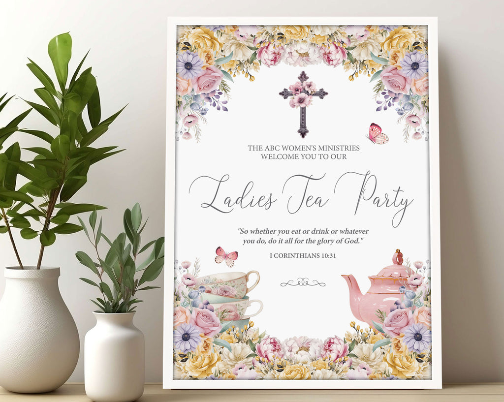 A3 Church Ladies Tea Welcome Sign in a white frame with Pastel flowers, Christian Cross and Teapot leaning up against a wall next to some greenery in vases