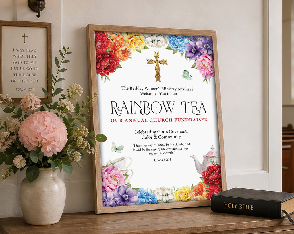 a bright A3 rainbow tea sign in a wooden frame leaning up against a church wall next to some flowers in a vase and a bible