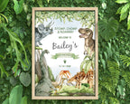 lots of dense greenery with a framed A3 dinosaur party welcome sign in a wooden frame laying on it