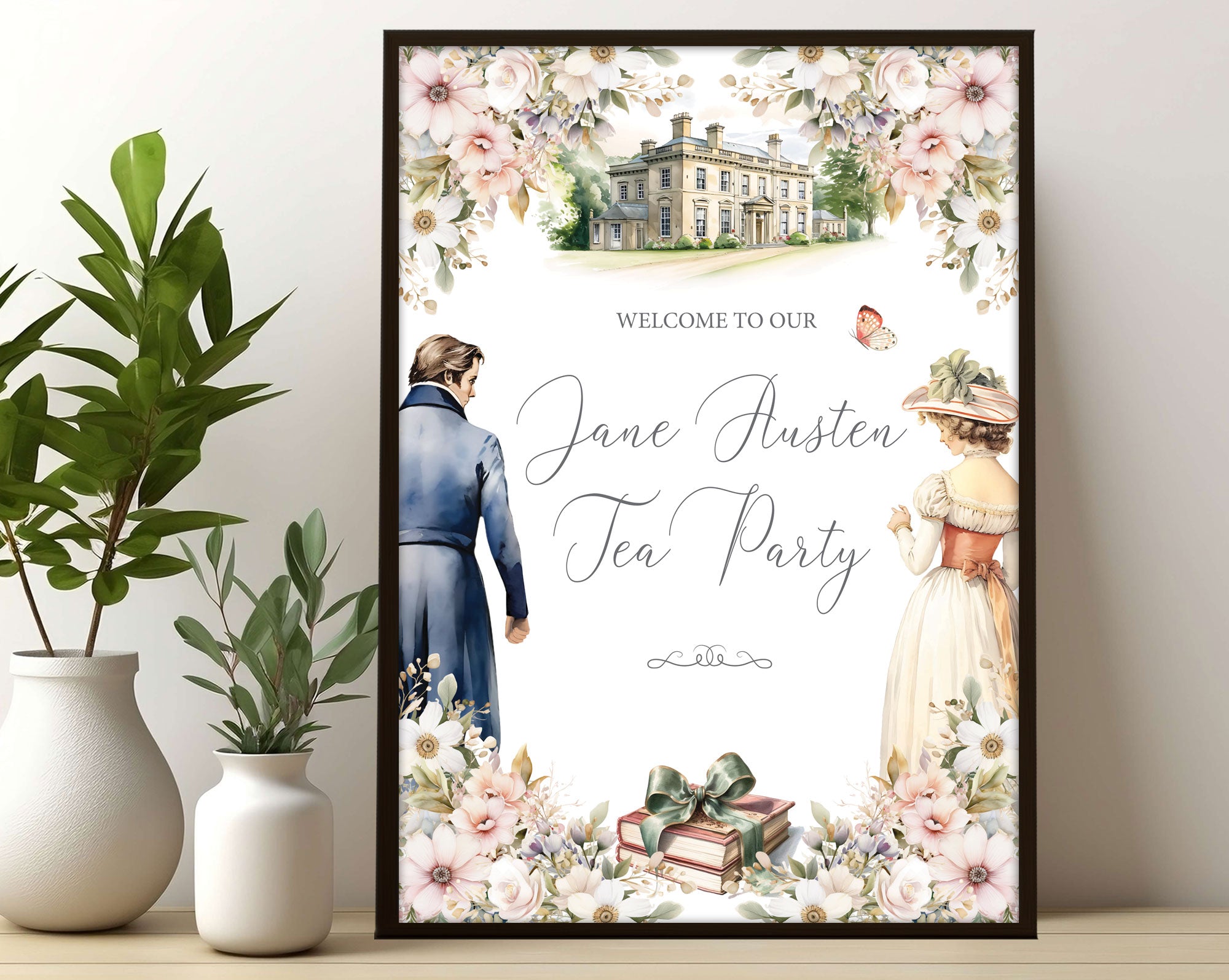 A3 jane austen party welcome sign with regency couple, books and mansion graphics in a black frame leaning up against a white wall next to greenery in vases