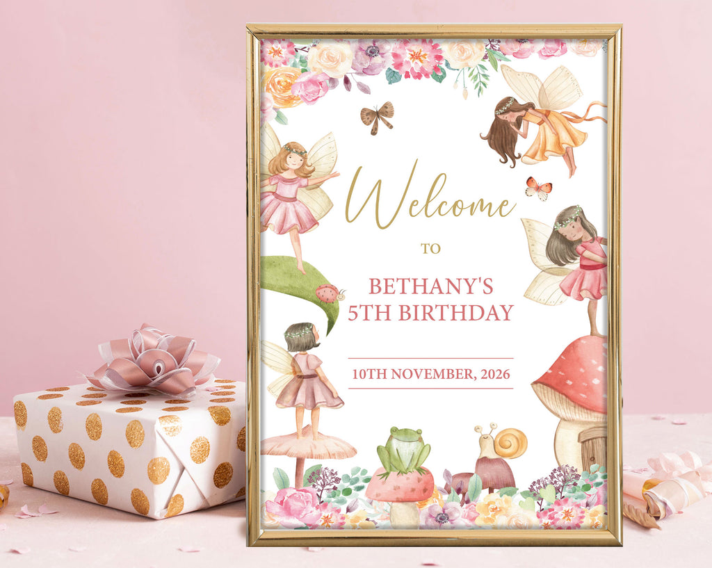 An A2 fairy party welcome sign with girl fairies, toadstool house, frog and snail graphics, leaning up against a pink wall next to a wrapped gift