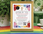 an A4 church ladies rainbow tea fundraising flyer in a gold frame, propped up on a table with a rainbow tablecloth with a white vase with greenery in the background